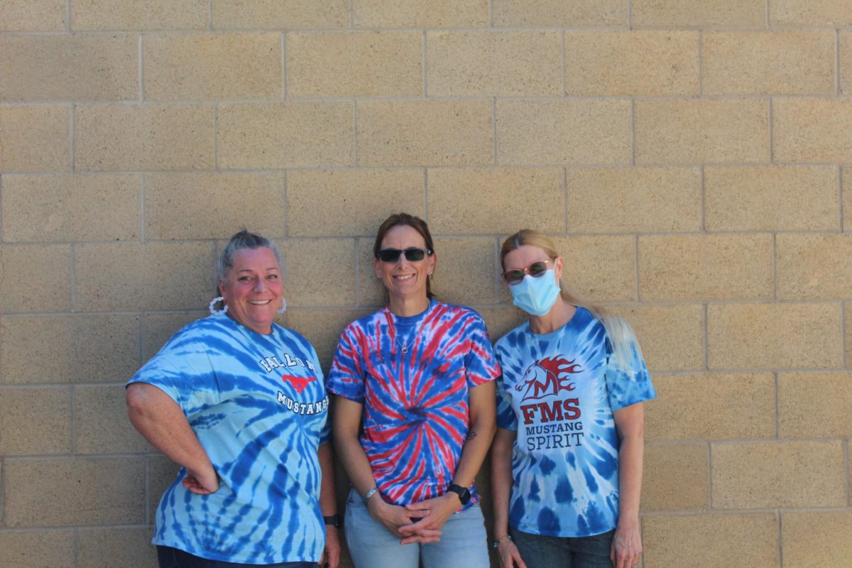 Teachers Ms. Harris, Mrs. Elissiry,  and Mrs. Lucas wear tie-dye shirts for Twin Day.